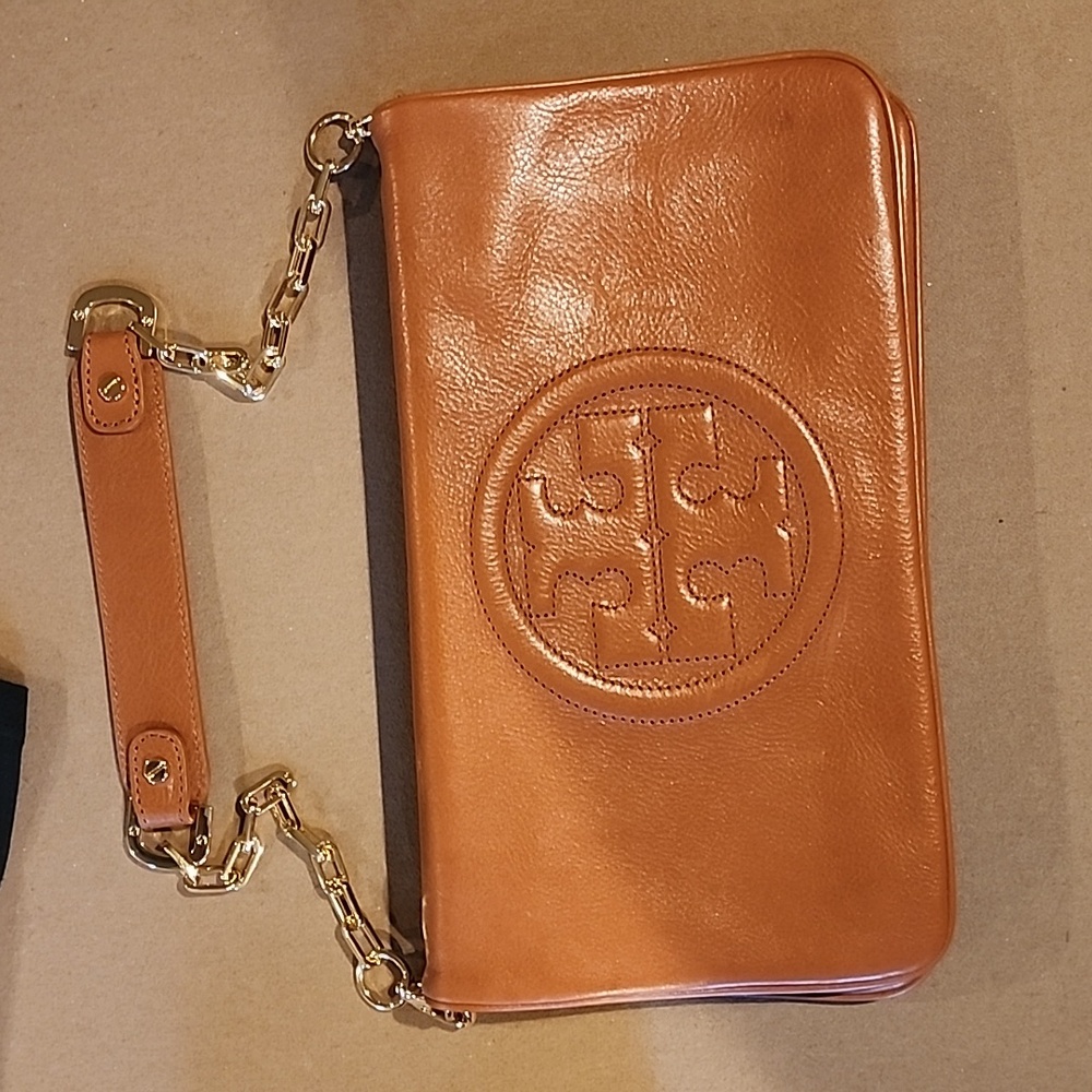 Tory Burch brown leather bag with gold hardware.